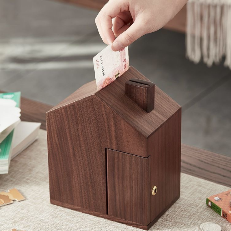 Wooden house shaped piggy bank