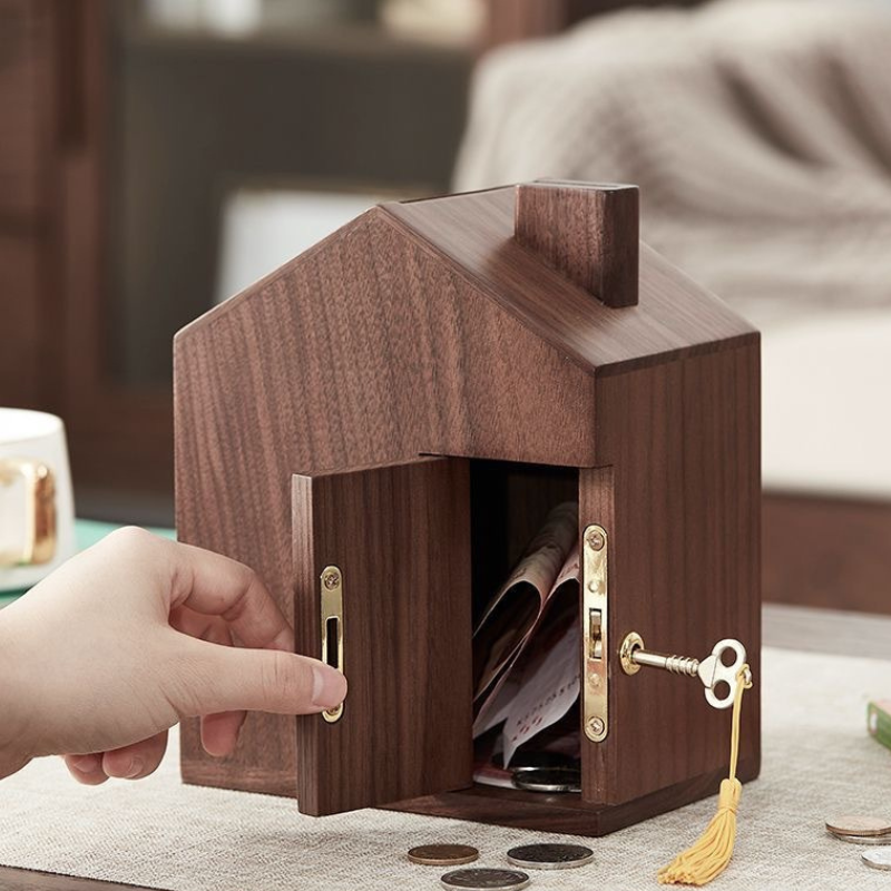 Wooden house shaped piggy bank