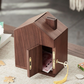 Wooden house shaped piggy bank